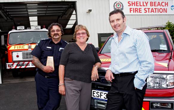 Adam Knezovic, Chief Fire Officer, Shelly Beach Voluntary Rural Fire Force, Penny Webster, Mayor, Rodney District Council and Phil Holden, Chief Executive, The Lion Foundation celebrating a special milestone grant.